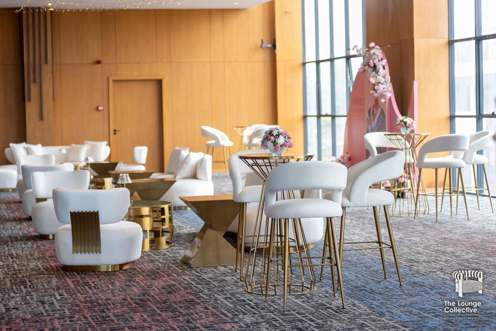 Several Brushed Gold lounge areas and cocktail tables across an events hall